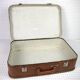 Cardboard and brown leather case