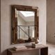Vintage gold wall mirror with a smoked mirror border.