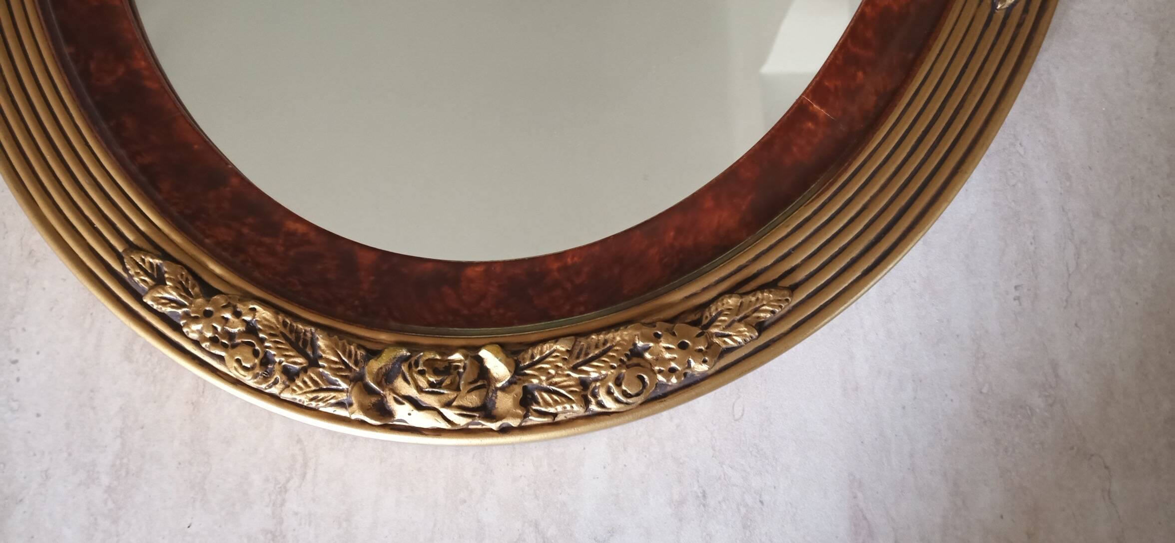 Modern oval mirror with flower decoration