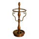 Umbrella stand and English-style wooden and brass canes, 20th century.