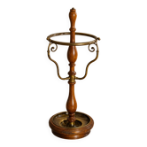 Umbrella stand and English-style wooden and brass canes, 20th century.
