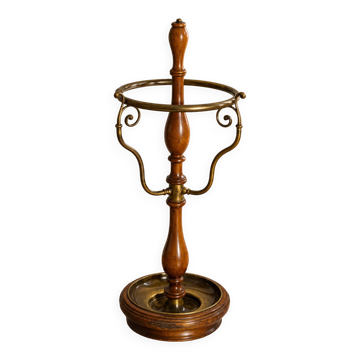 Umbrella stand and English-style wooden and brass canes, 20th century.
