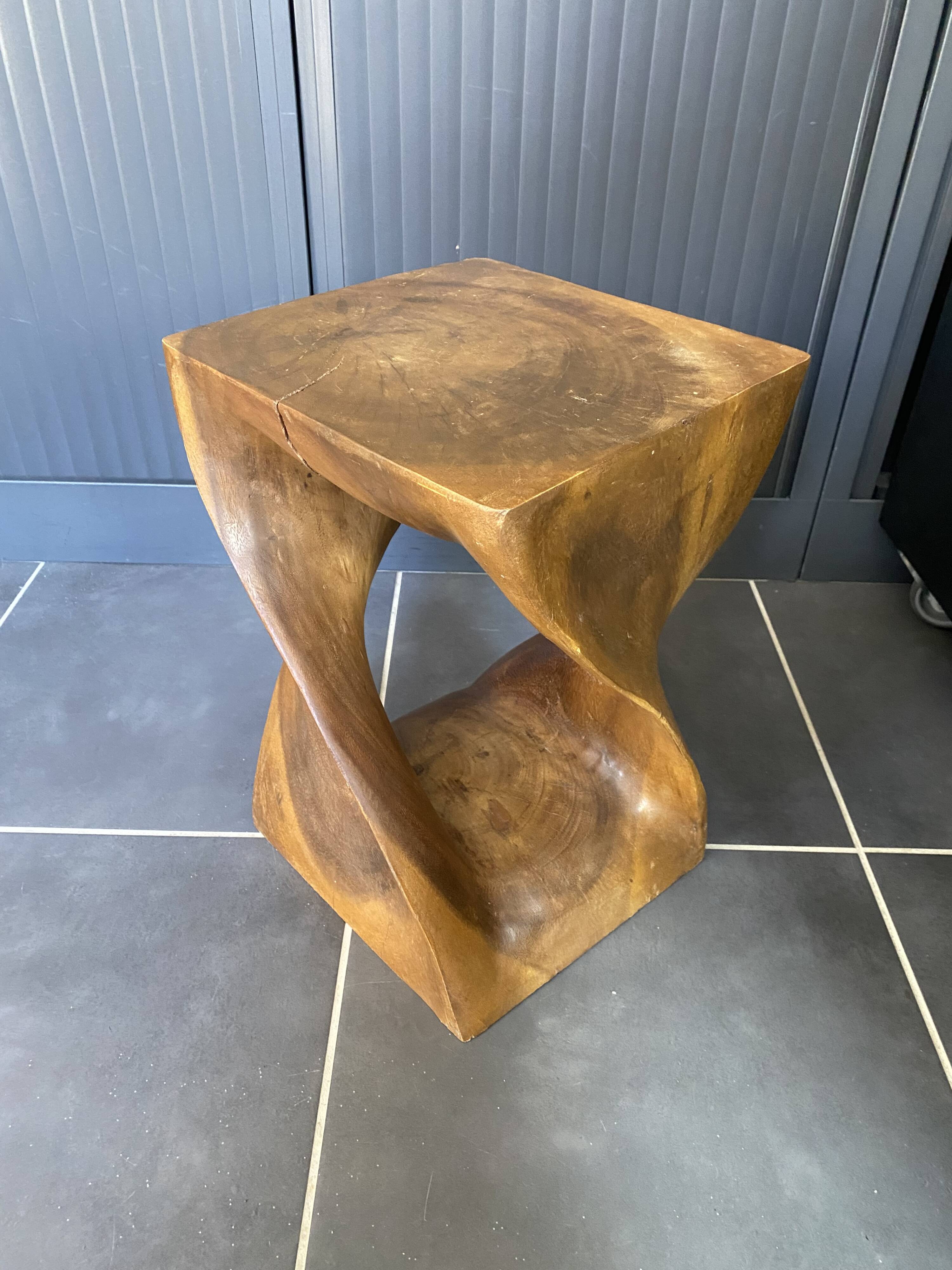 Stool no. 1 in solid raw walnut wood, carved from the mass, 1970.