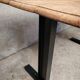 Unique wooden table with metal industrial legs.