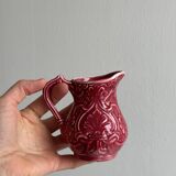 Red ceramic milk jug
