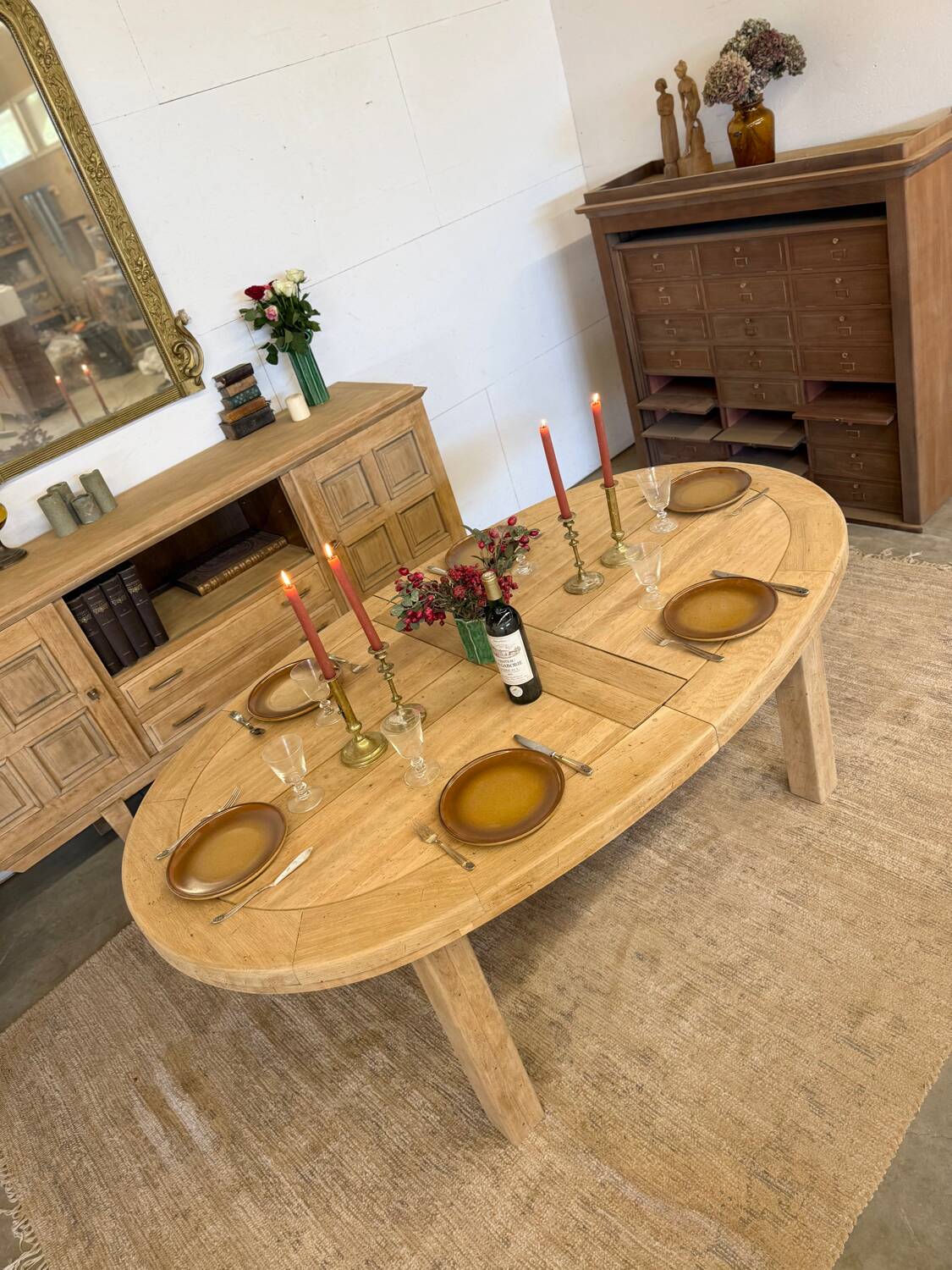 Oval farmhouse table in solid oak with extensions.