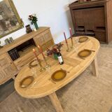 Oval farmhouse table in solid oak with extensions.