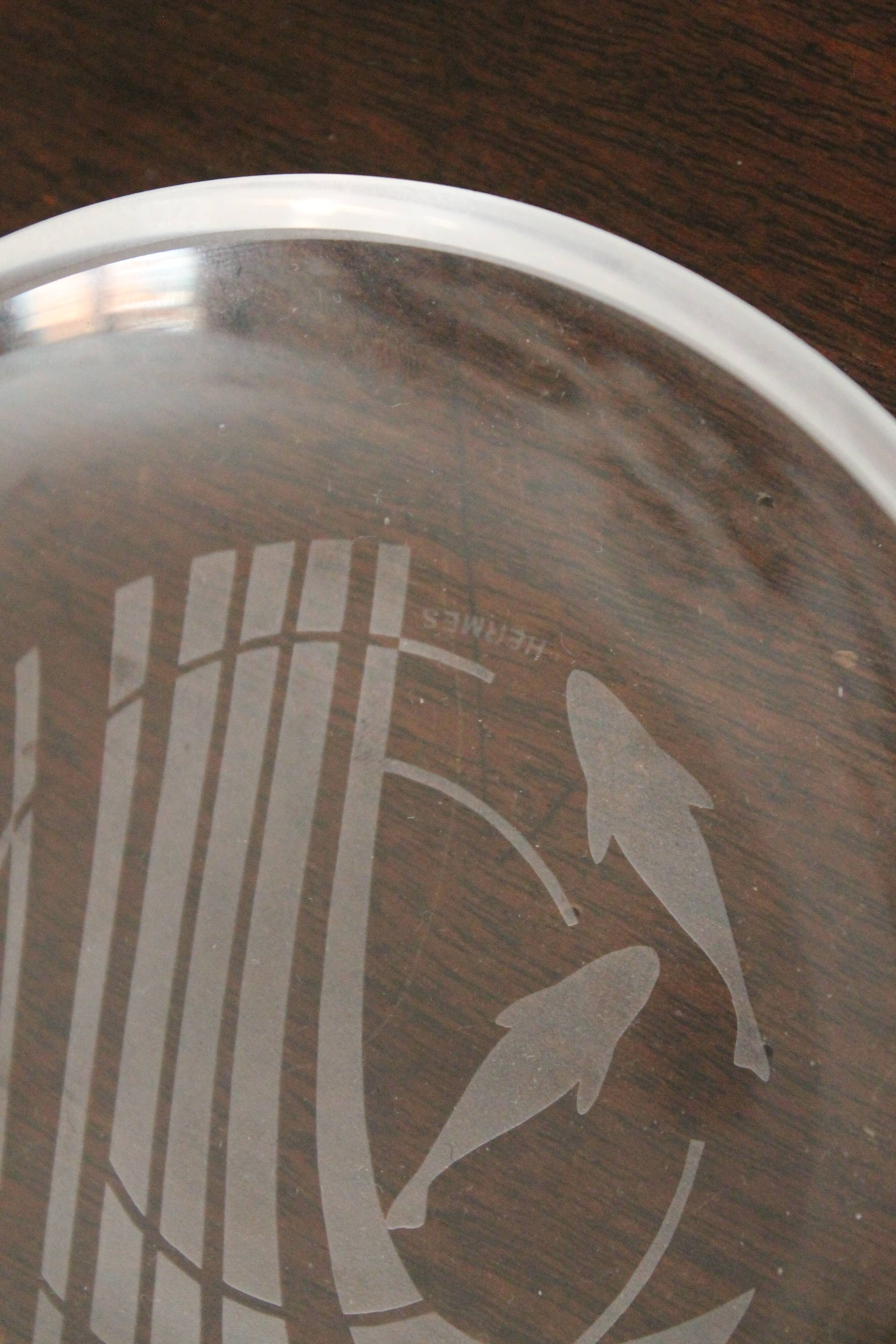 Hermès pair of glass plates with a dolphin pattern.