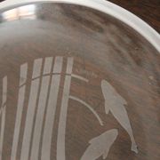 Hermès paire d'assiettes en verre à motif de dauphins