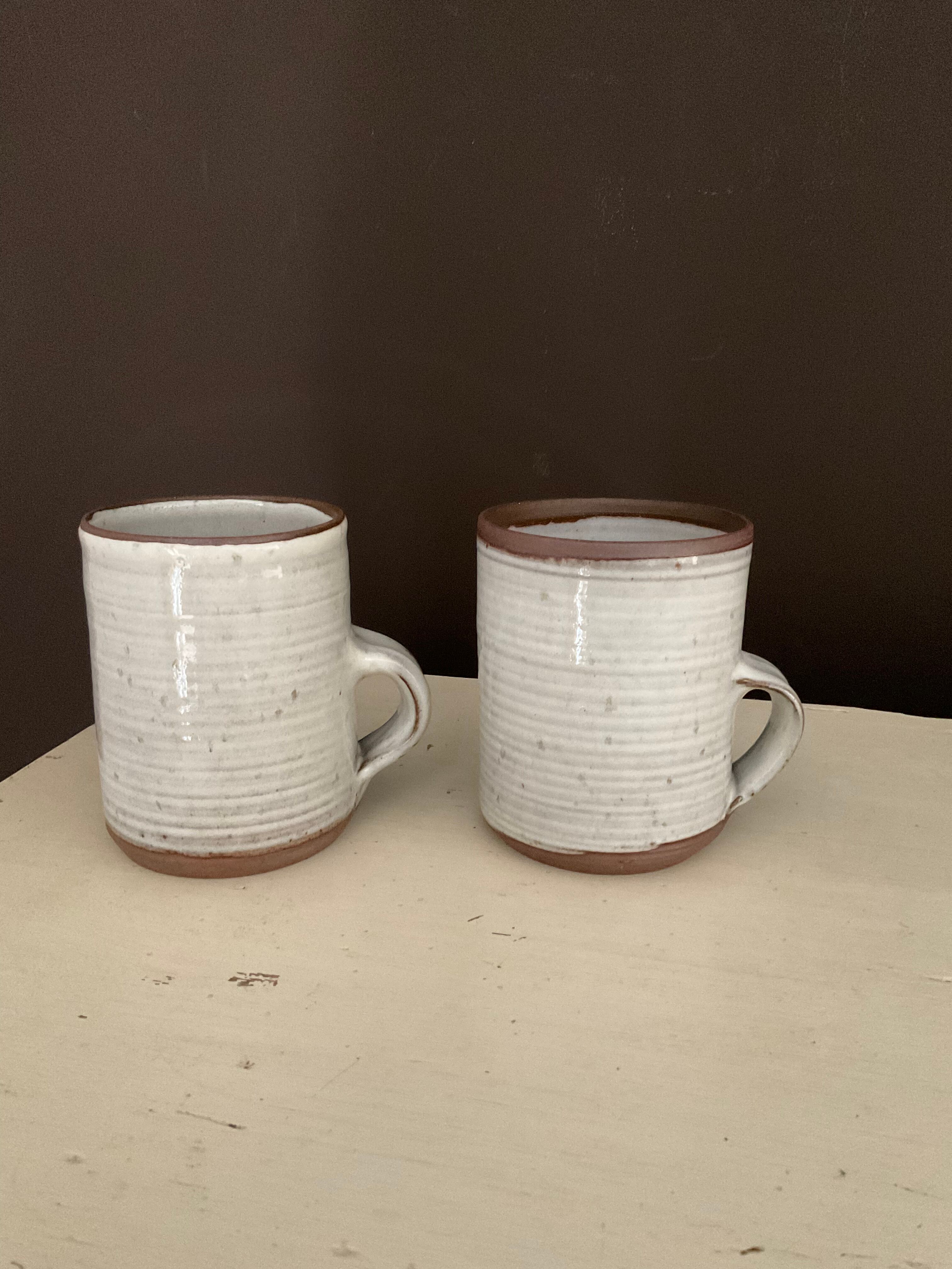 2 Mugs in Sandstone.Roger Jacques St Amand .vintage