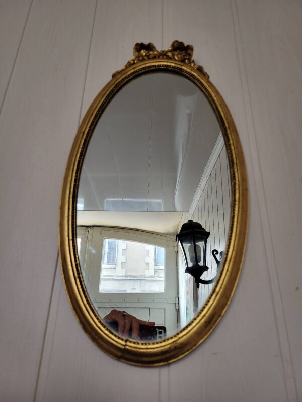 Miroir ovale style Louis XVI