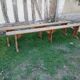 Pairs of large benches in raw fir wood.