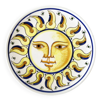 Decorative ceramic plate with sun face