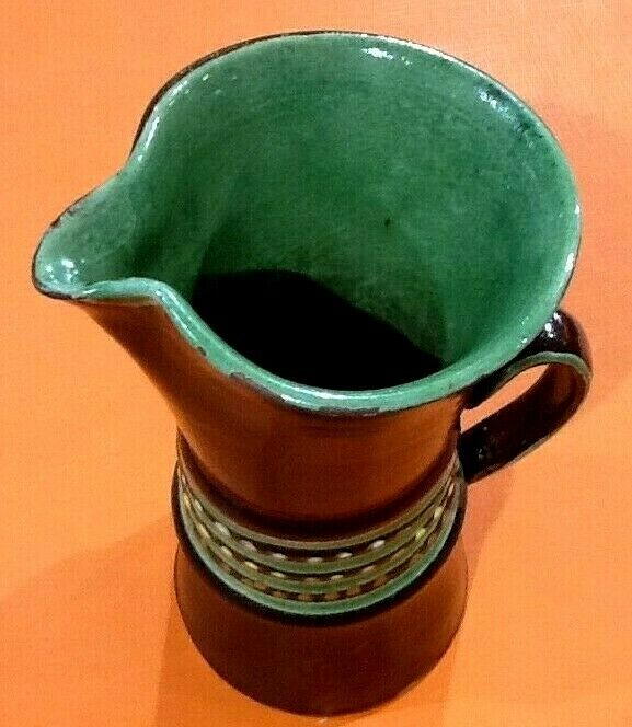 Glazed terracotta pitcher decorated with beaded friezes