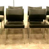 Suite of eight vintage chairs in chrome and imitation leather XX century