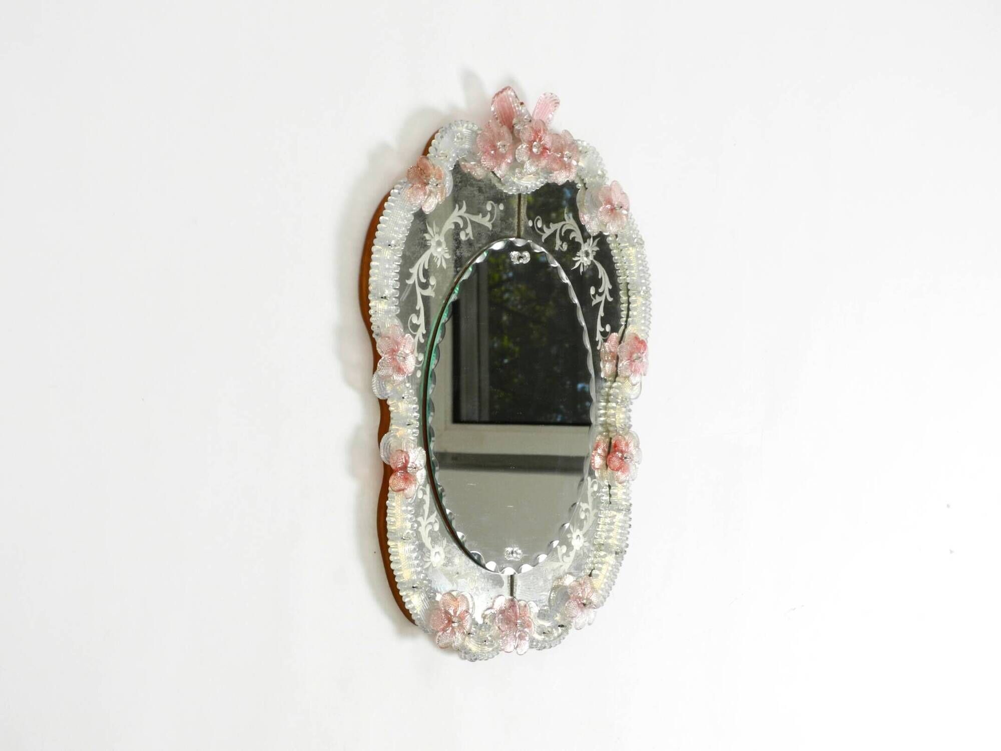 Italian mid-century wall mirror with a Murano glass frame and blossoms