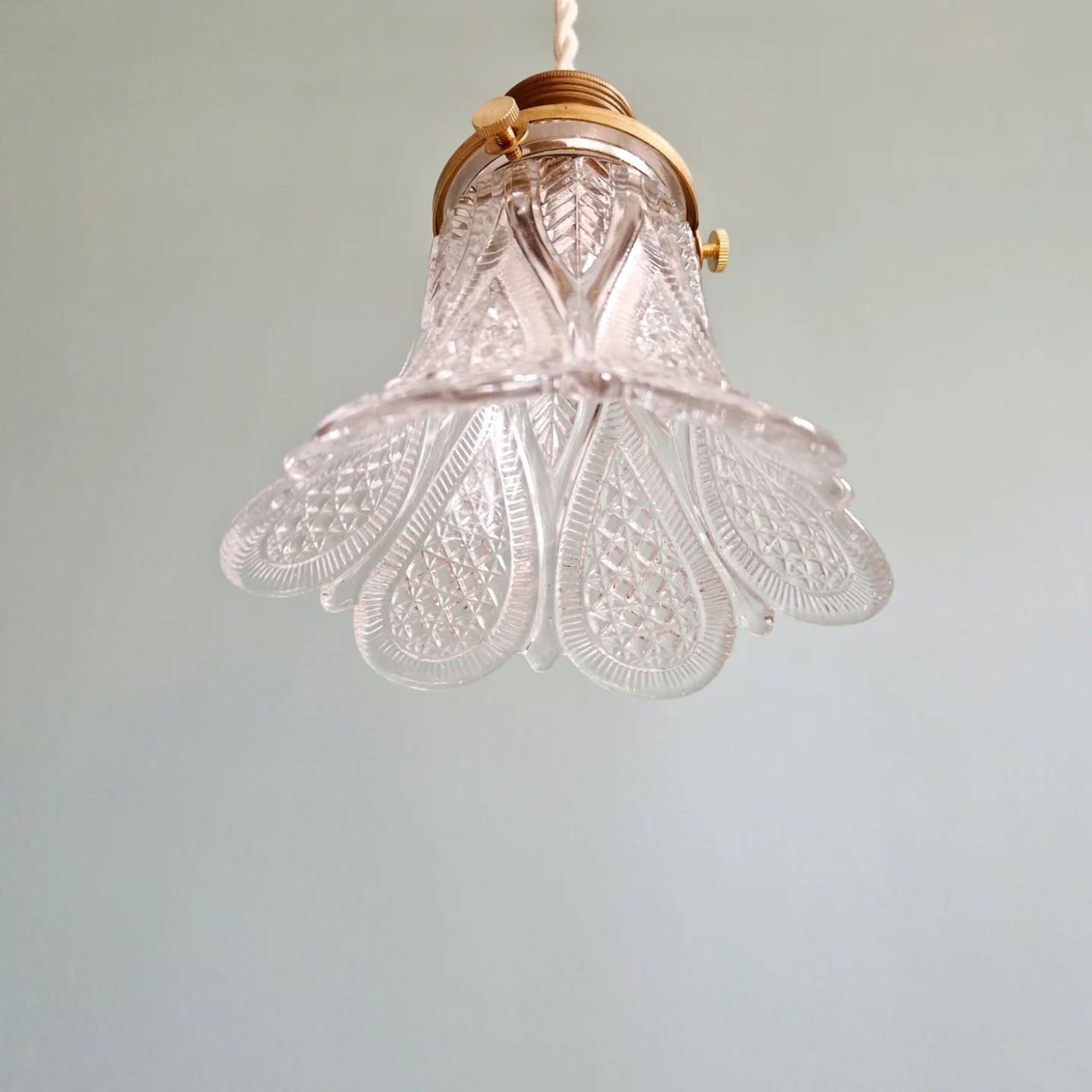 Art Deco trio of pendant lights/table lamps in clear glass, 1920s-30s.