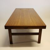 Table basse en teck avec feuille d'extension noire, design danois, années 1960.