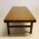 Table basse en teck avec feuille d'extension noire, design danois, années 1960.