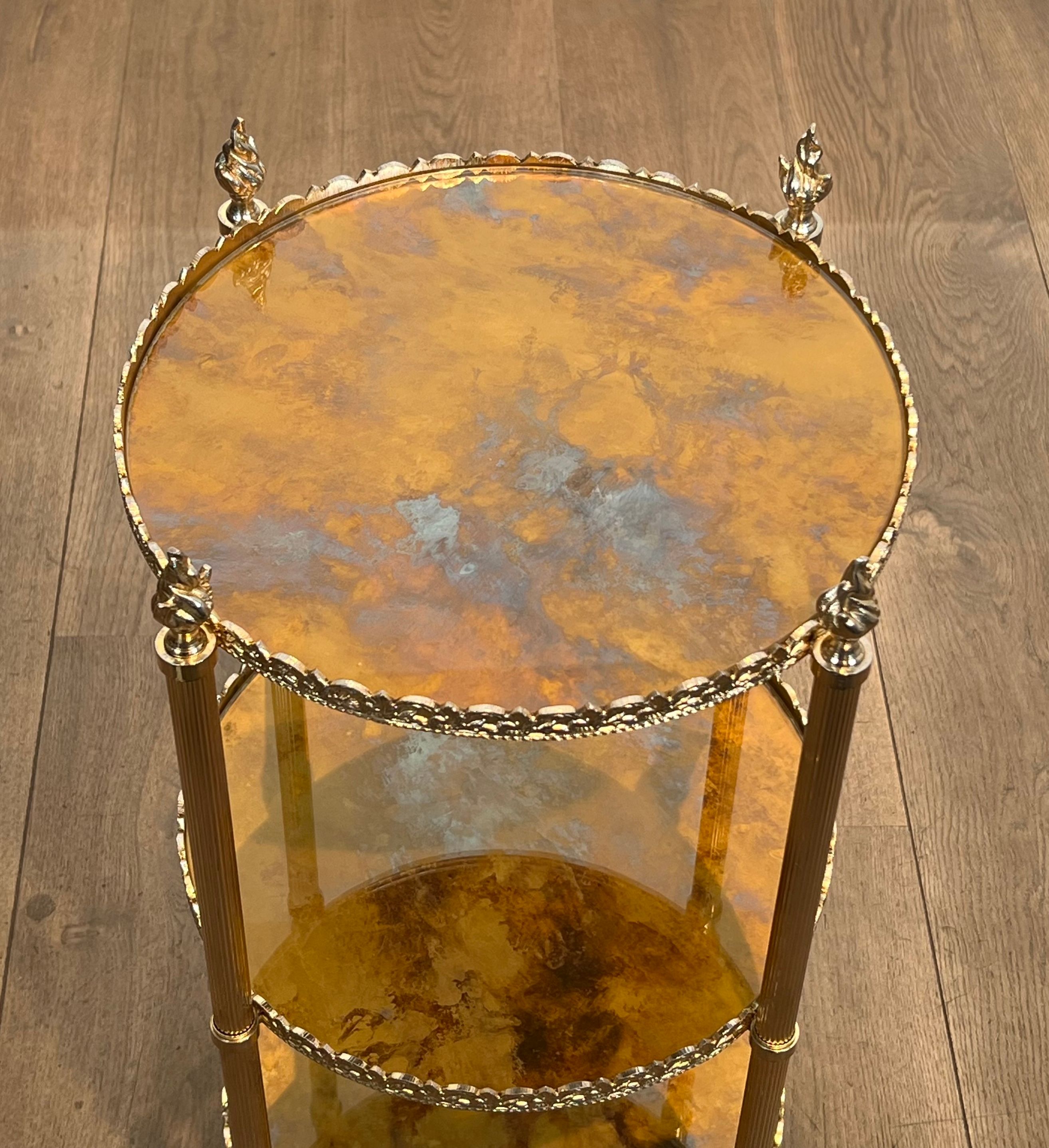 Round silver-plated brass table with triple eglomisé mirror tops from Maison Jansen.