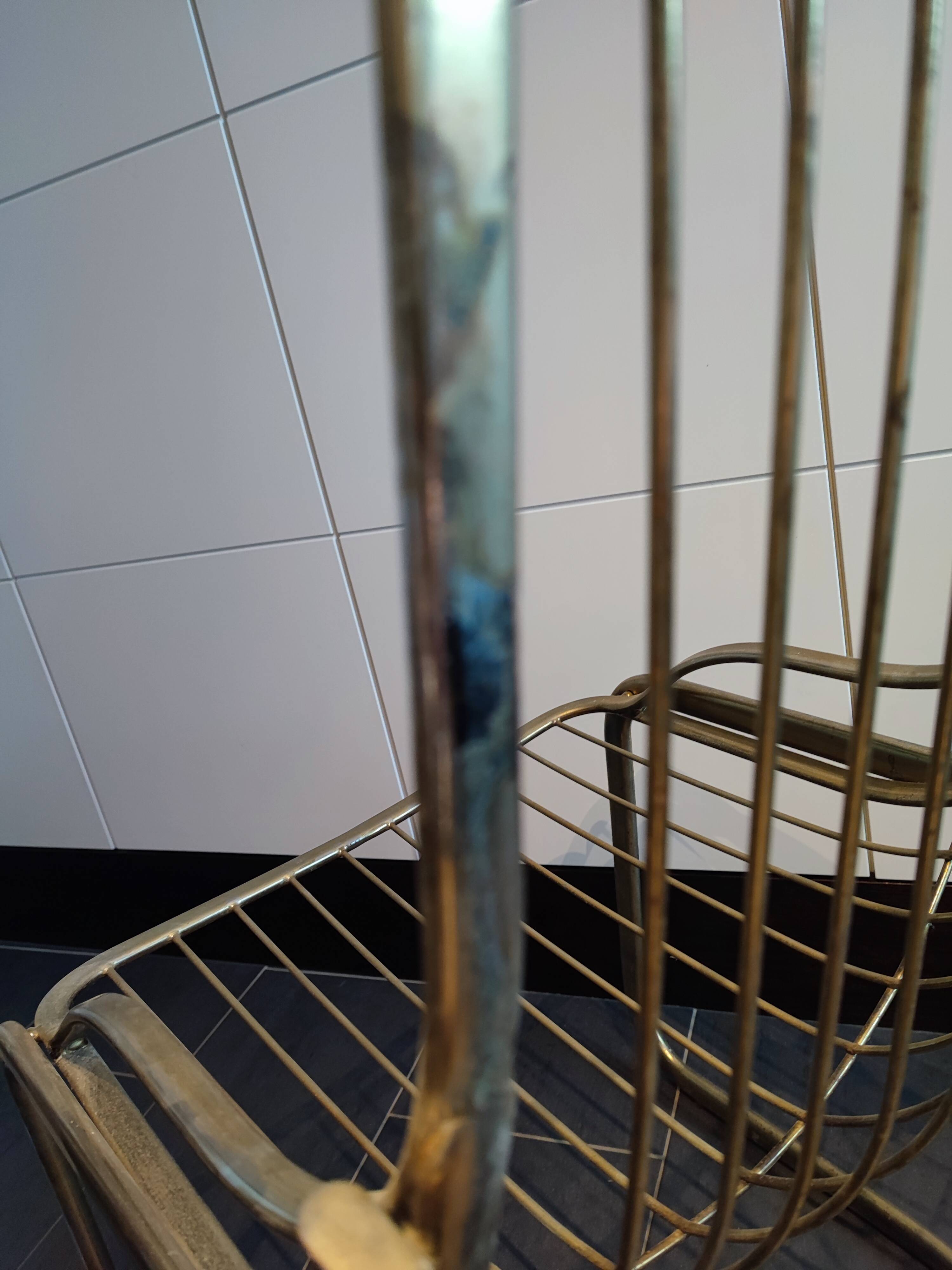 Tubular metal chair covered with gilding