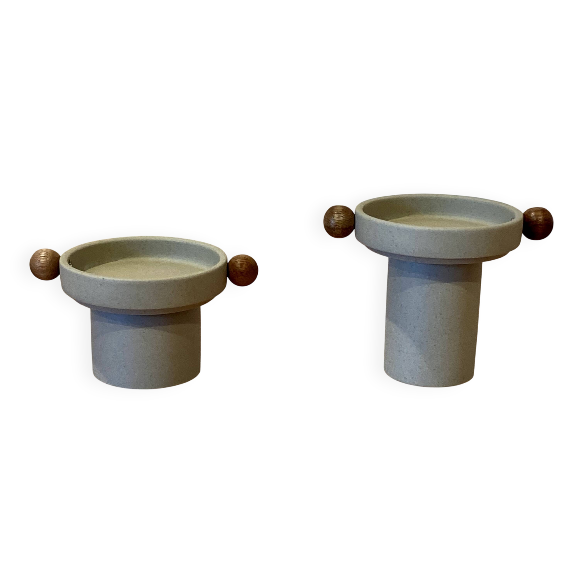 A pair of Scandinavian design candle holders.