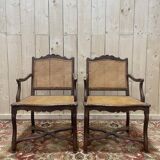 Paire de fauteuils de style Louis XIII os de mouton en cannage.