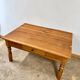Antique coffee table in solid elm with turned legs.