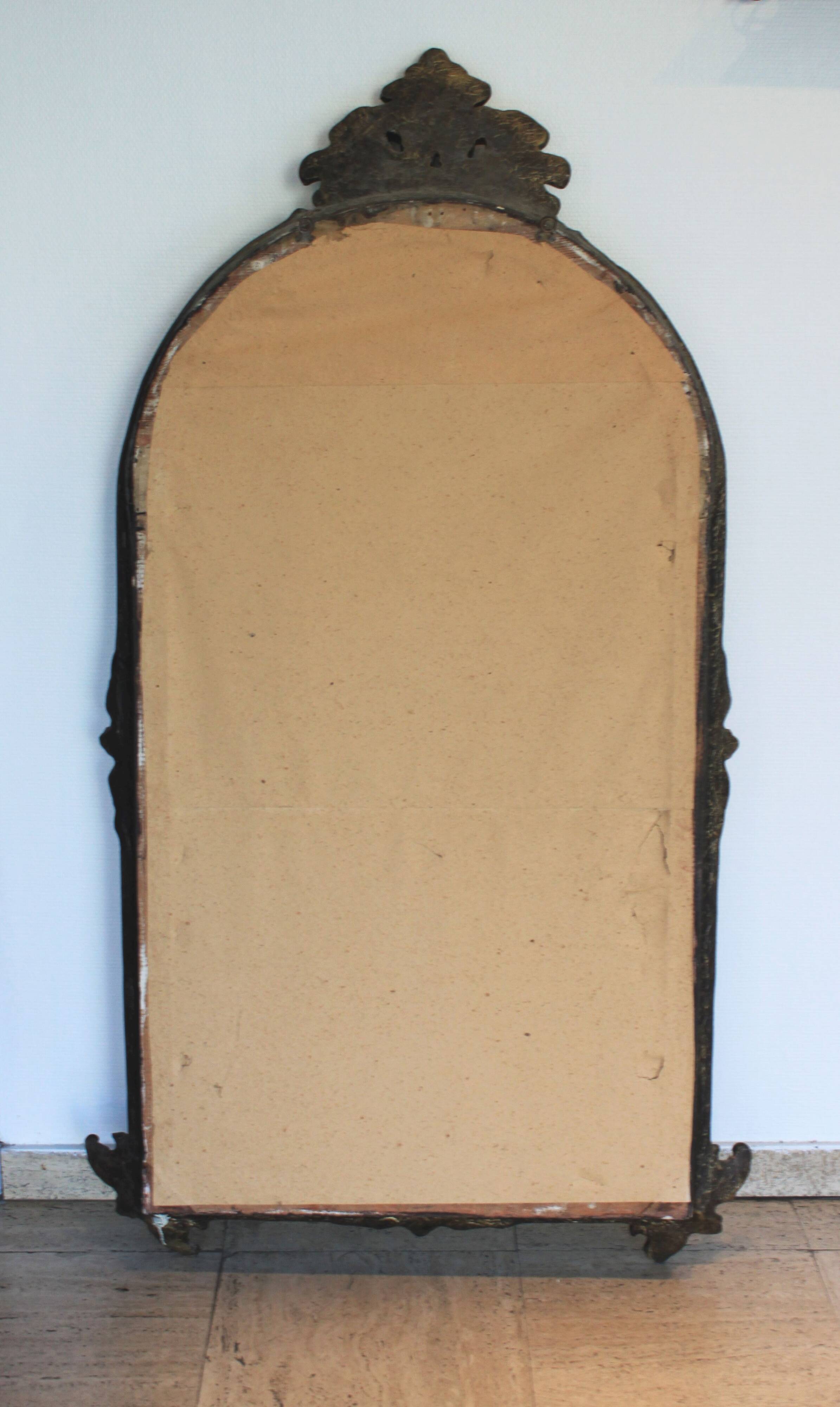 Baroque “trumeaux” mirror in carved solid wood.