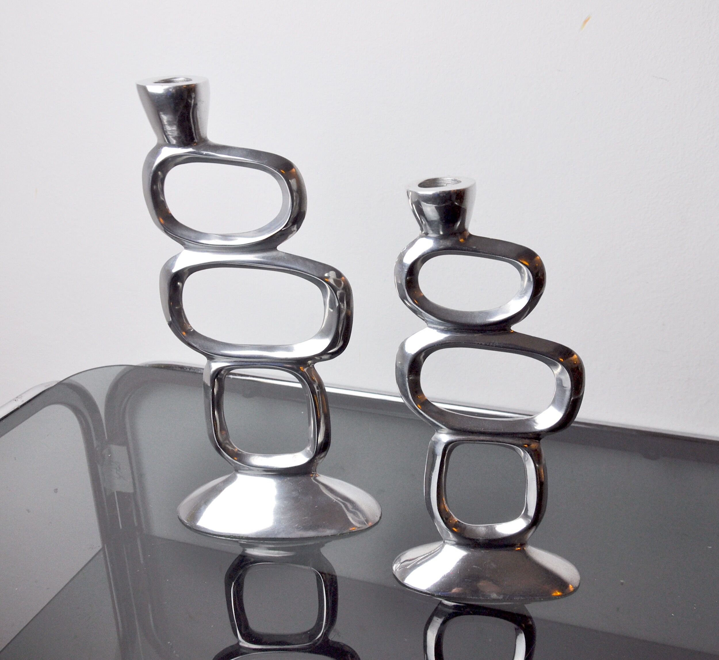 Pair of circle candlesticks by Matthew Hilton, England, 1980