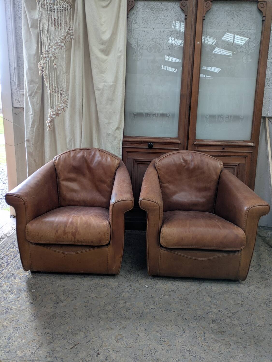 Pair of leather armchairs