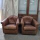 Paire de fauteuils cuir