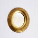 Golden oval mirror