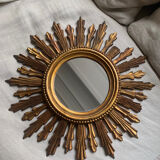 Sun mirror in old wood
