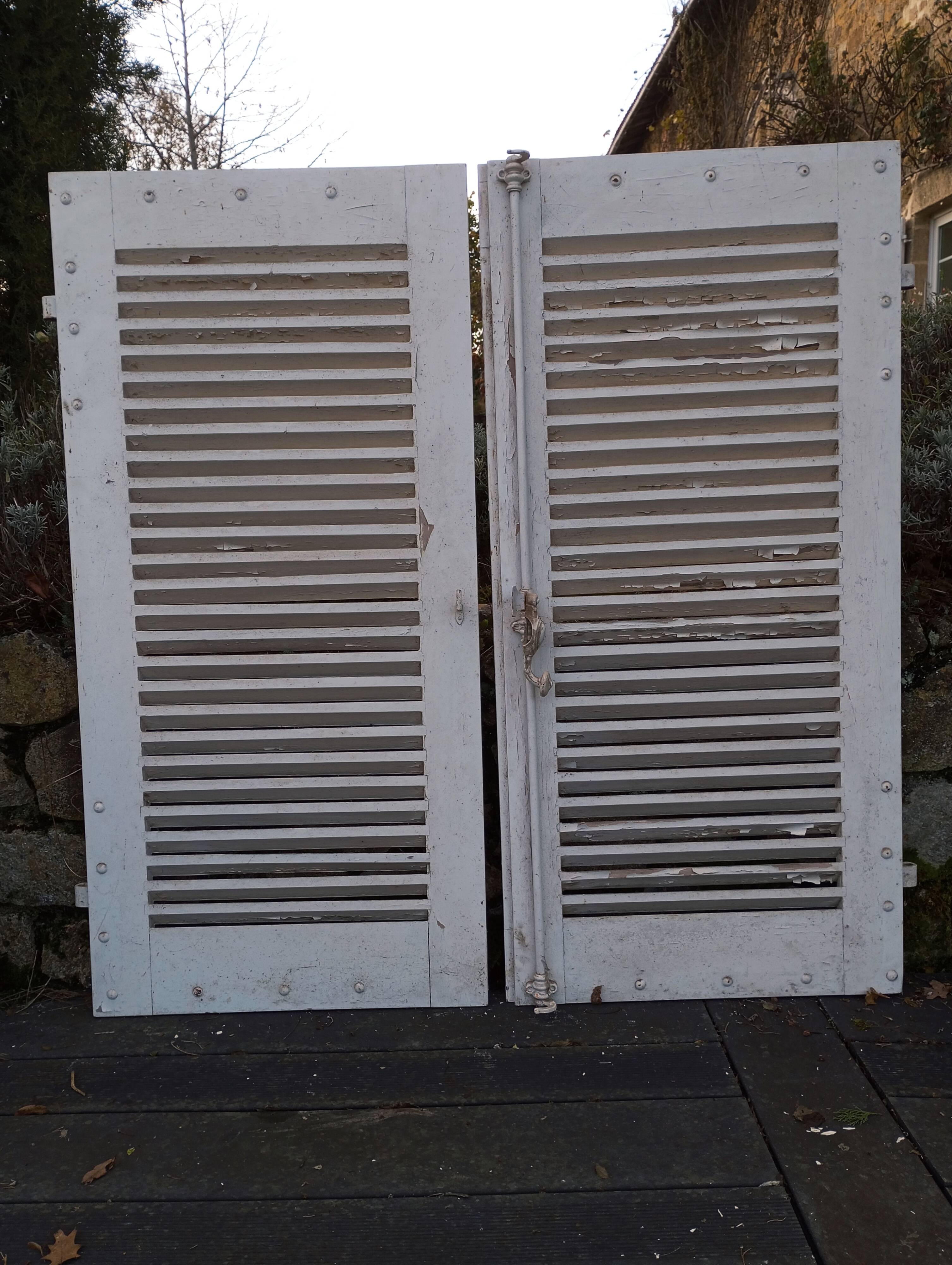 Pair of tropical wood shutters