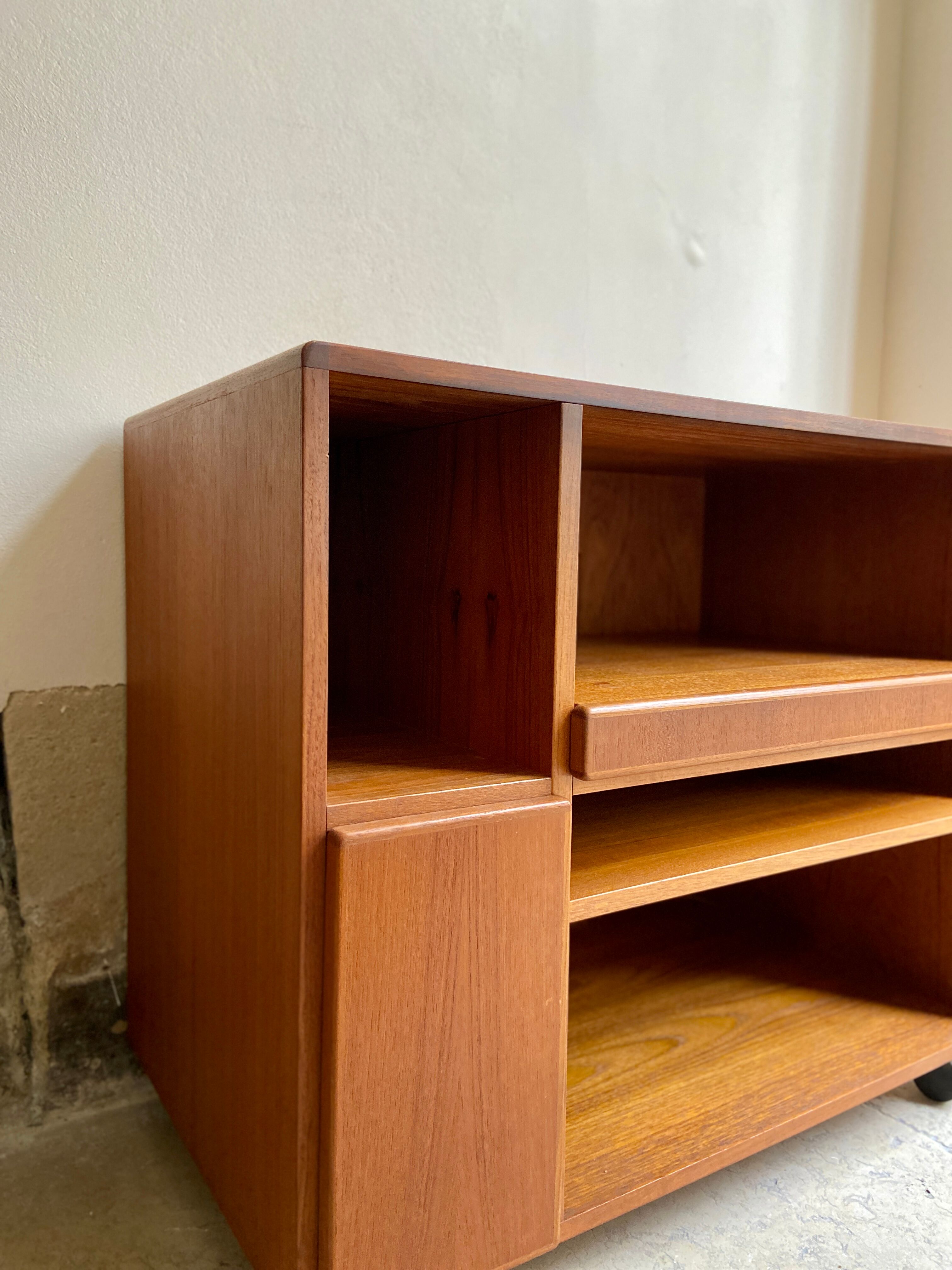Danish storage cabinet Komfort on teak and rosewood wheels