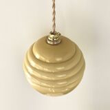 Pale yellow opaline ball suspension