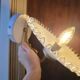 Pair of wall sconces in brass and wavy opaline glass