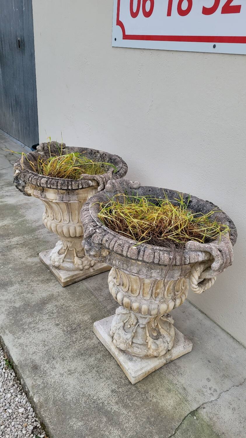 Pair of planter vases decorated with faces in reconstituted stone 1950s