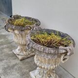 Pair of planter vases decorated with faces in reconstituted stone 1950s