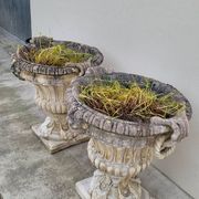 Pair of planter vases decorated with faces in reconstituted stone 1950s