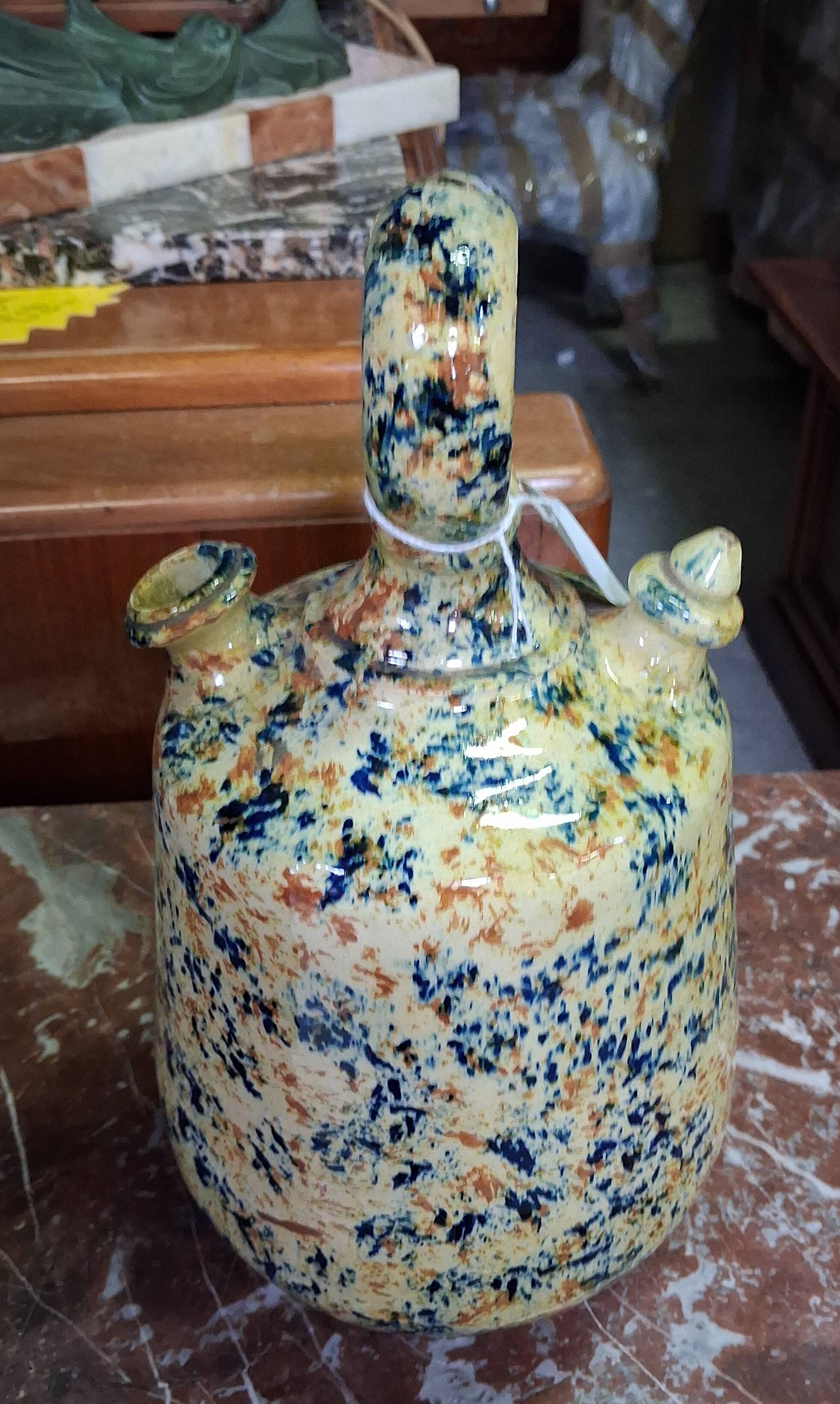 polychrome floral-decorated jug in glazed ceramic