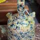 polychrome floral-decorated jug in glazed ceramic