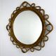 Miroir ovale en rotin et bambou espagnol, vers les années 1960.