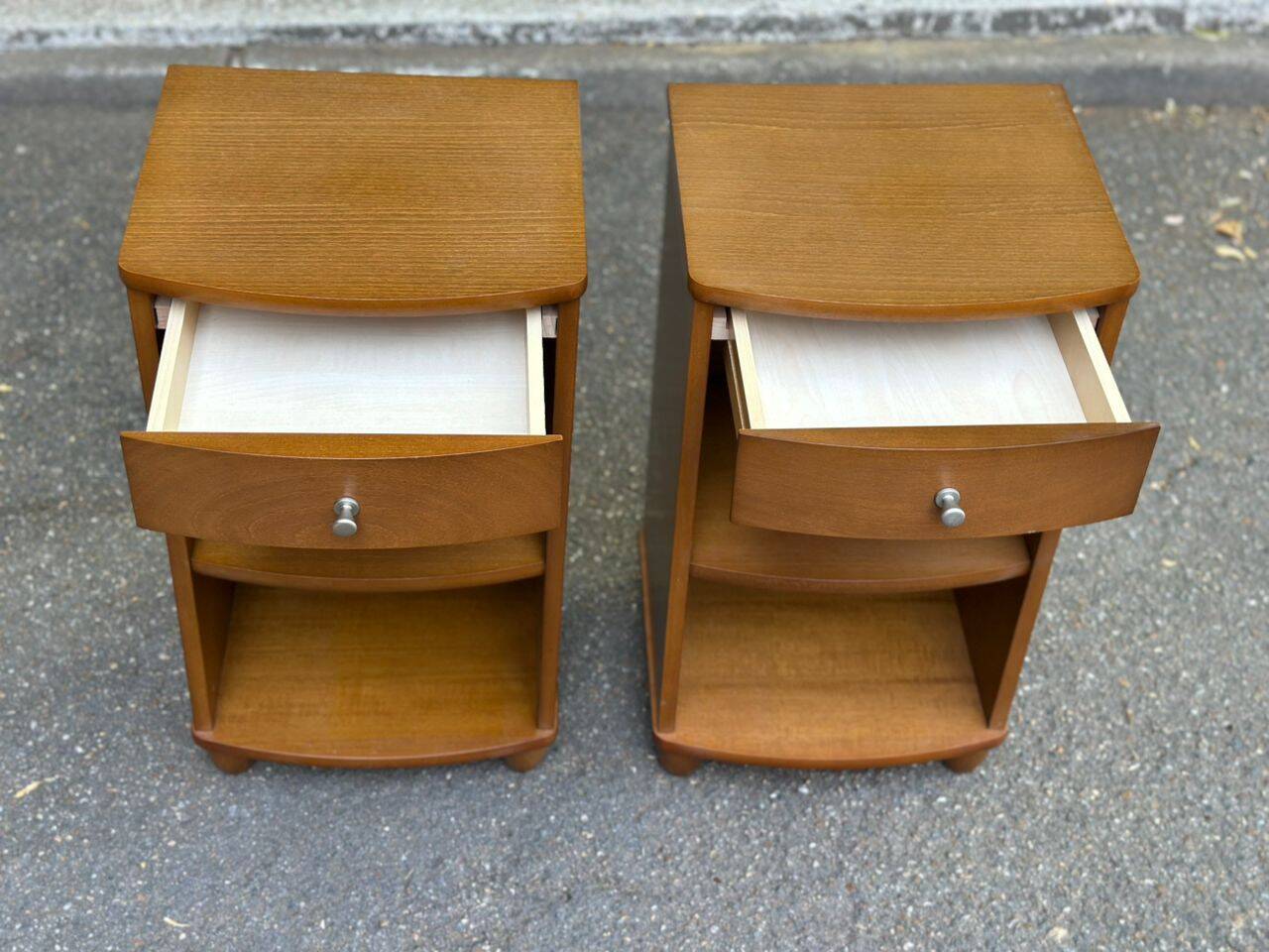 2 contemporary wooden bedside tables from the 2000s.