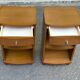 2 contemporary wooden bedside tables from the 2000s.