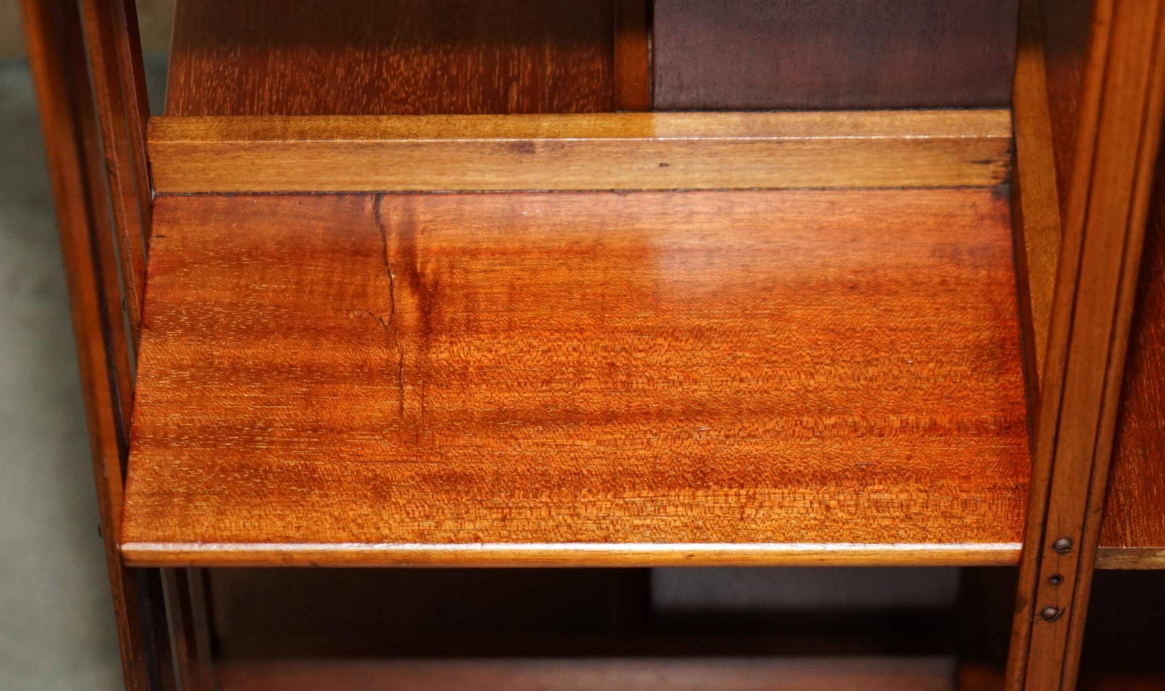 Sheraton-style rotating library table in walnut and satinwood.