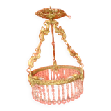 circular chandelier with a brass frame equipped with crystal drops