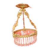 circular chandelier with a brass frame equipped with crystal drops