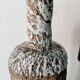 Sculptural vase with a mineral Boho spirit.